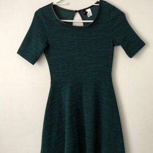 Elegant dark green dress with leather neck lining